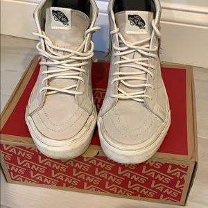 Suede fringe Vans high top sneakers.